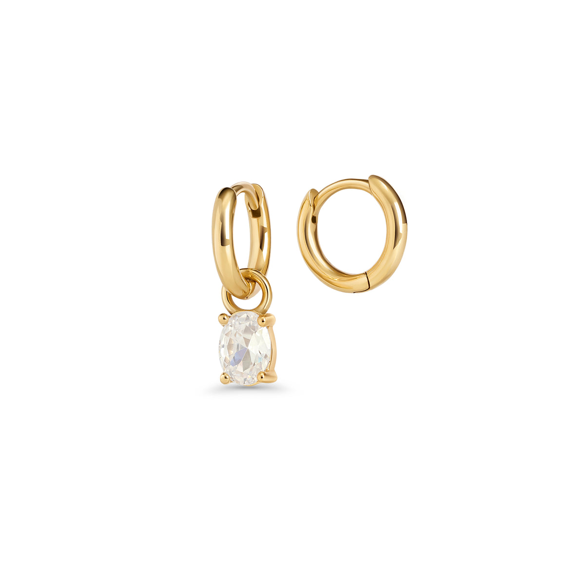 Gold hoop earrings with an oval clear stone pendant in a prong setting on a white background. 2-in-1. Jewelry by Mia Bijoux Canada.
Boucles d'oreilles anneaux dorées avec pendentif serti sur griffes d'une pierre transparente ovale sur fond blanc. 2-in-1. Bijoux par Mia Bijoux Canada.